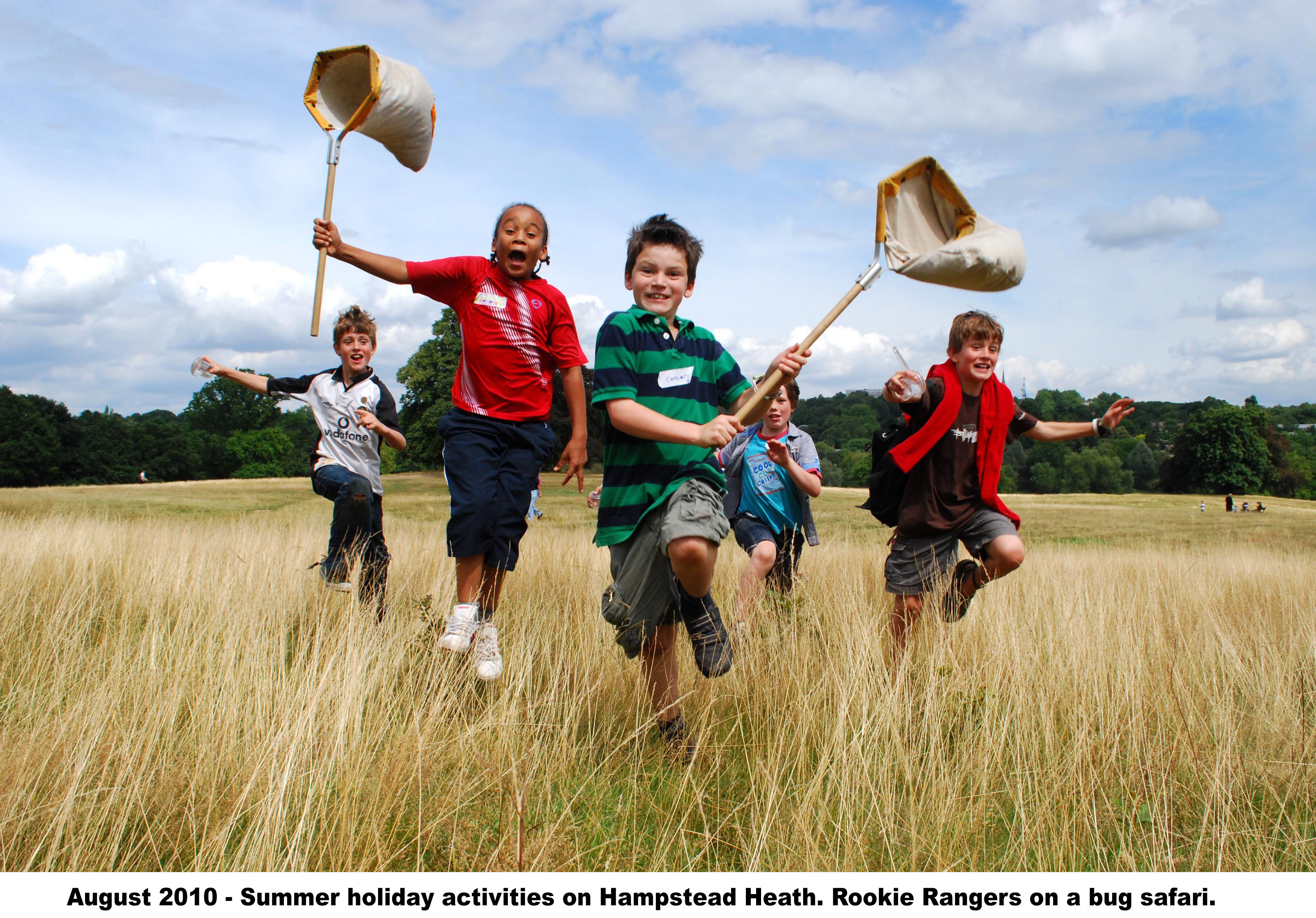 young people running across Hampstead Heath