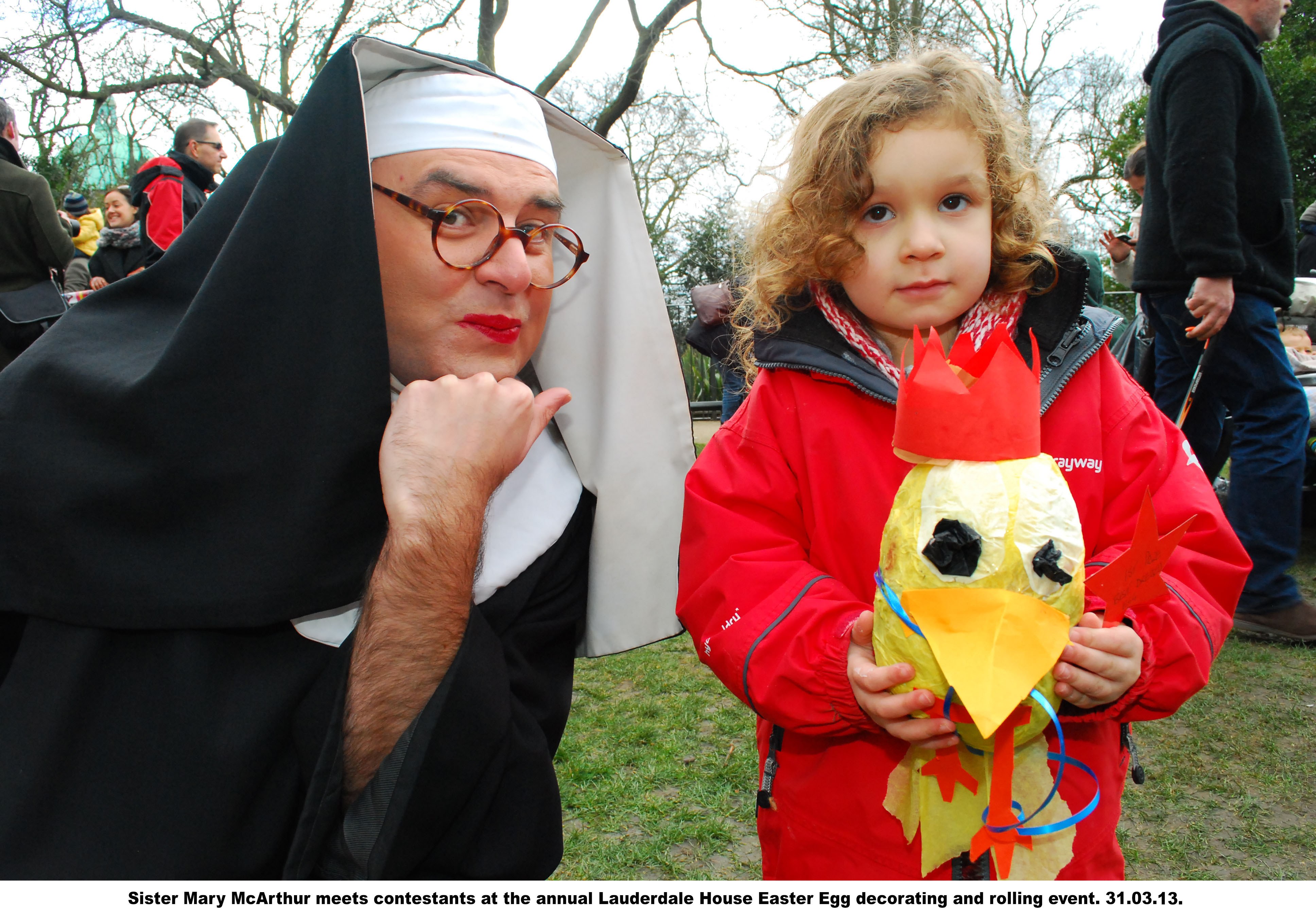 nun with child with decorated egg
