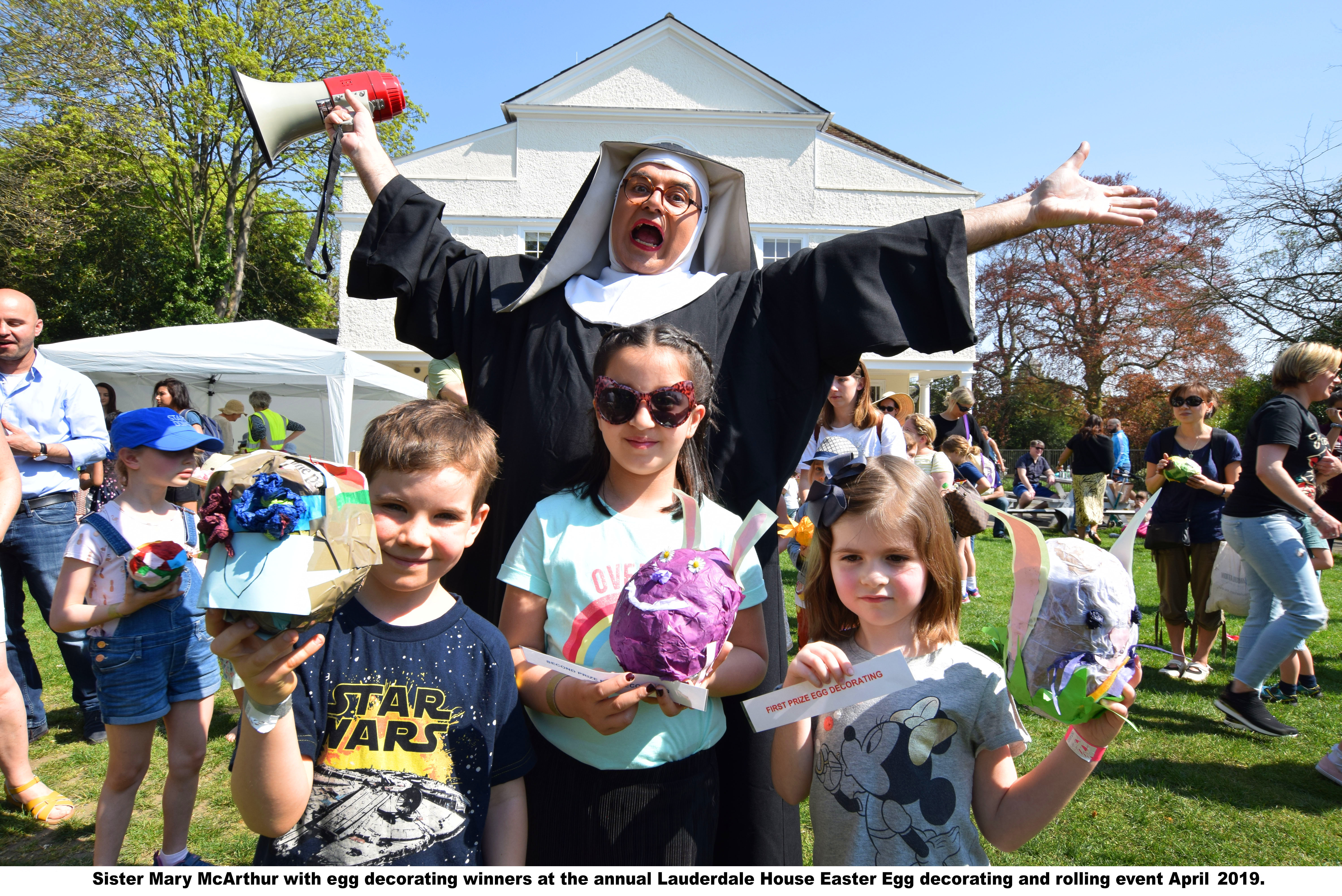 nun in front of Lauderdale House withe gge decorating competition winners