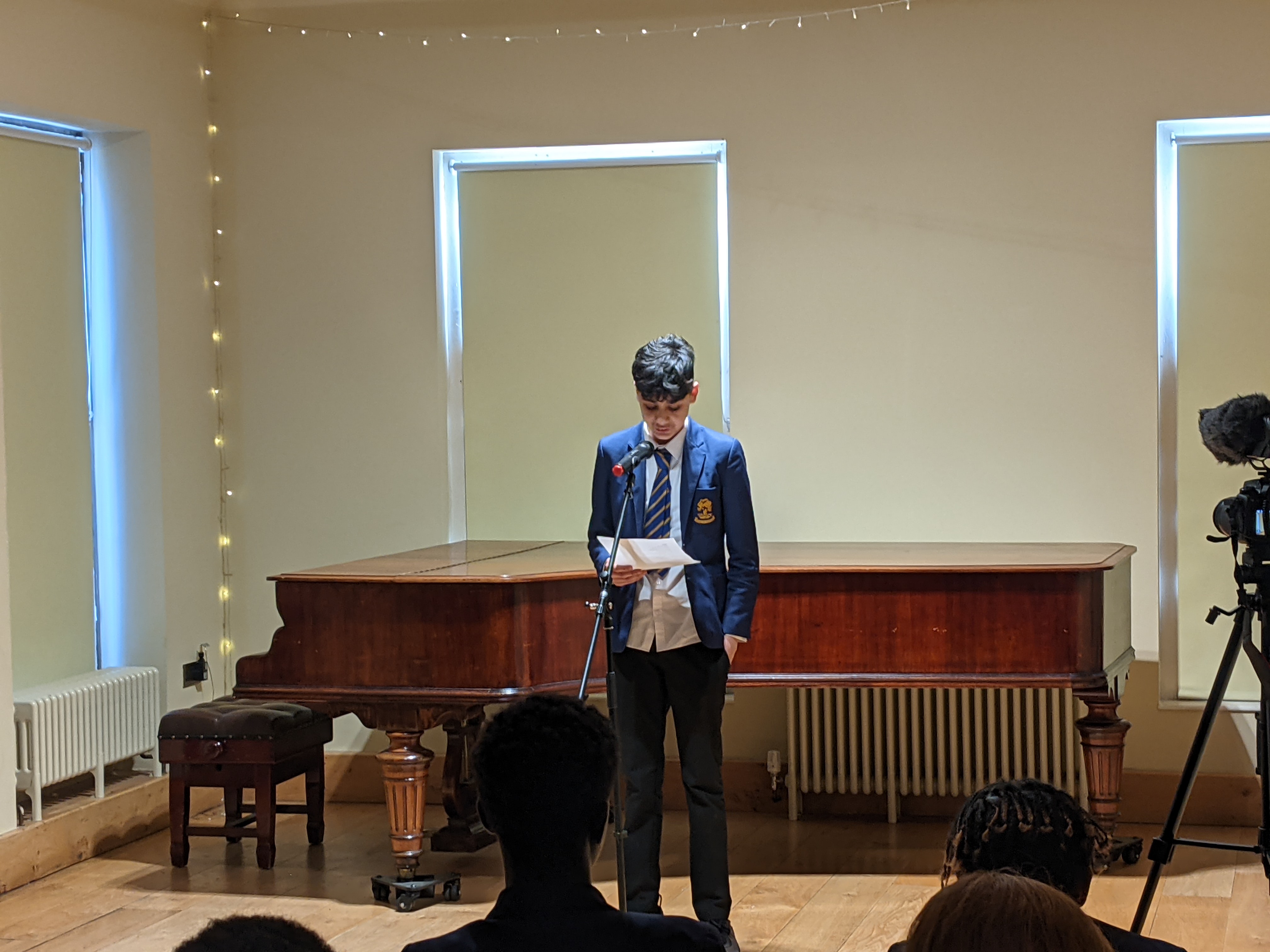 A boy reading a poem