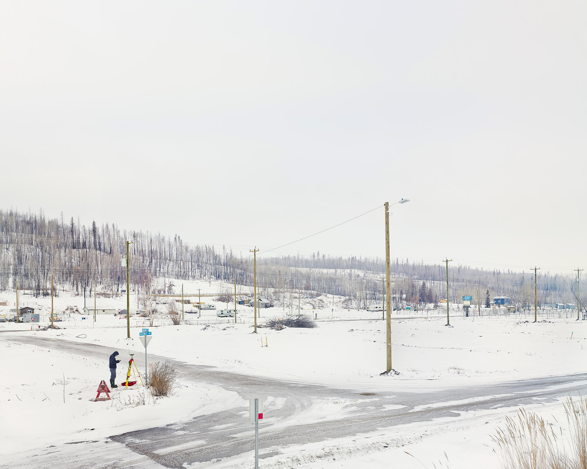 photograph of a quiet snowy road