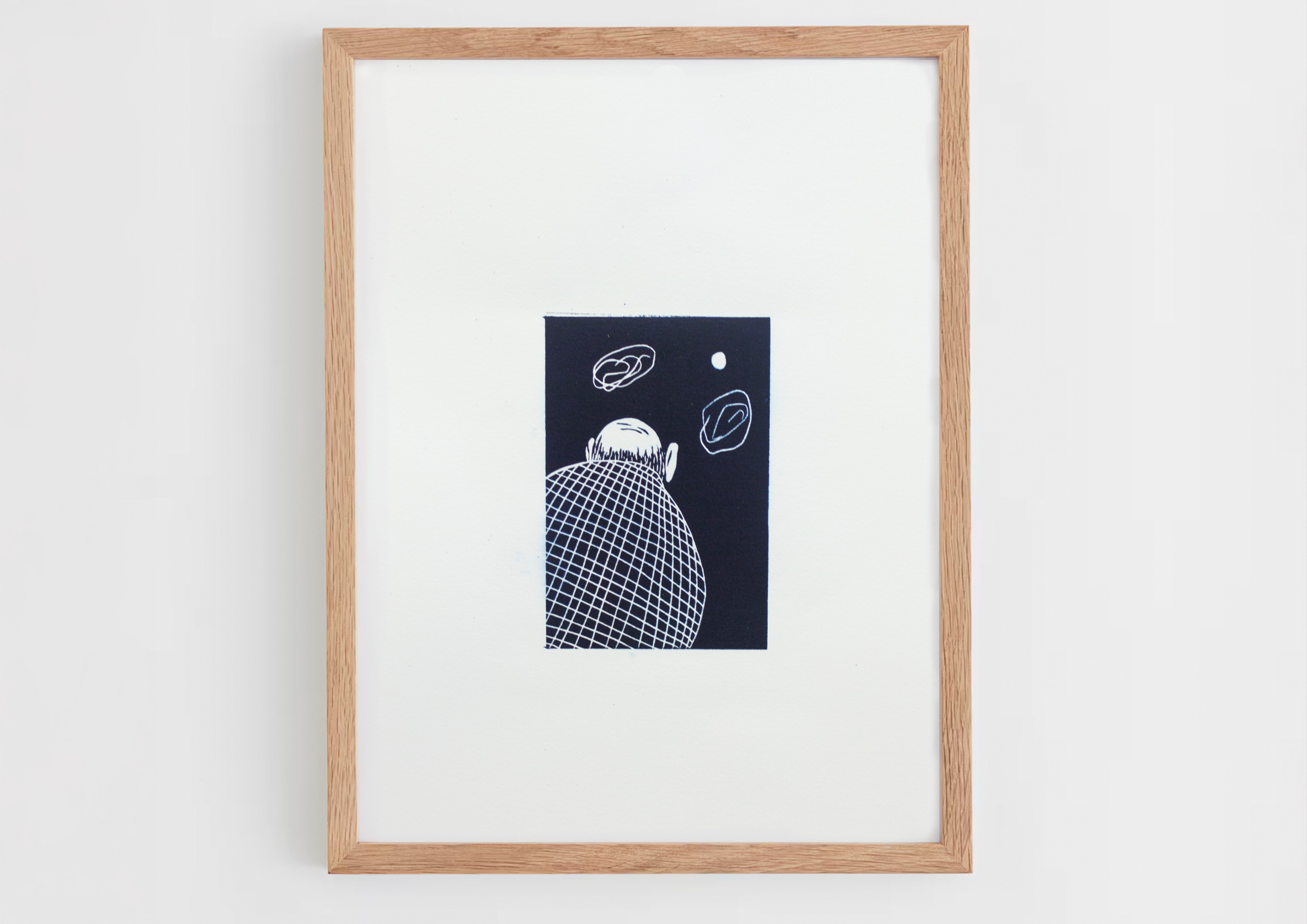this black and white print shows a person's back as they look at abstract shapes by Lily Rose Grant 