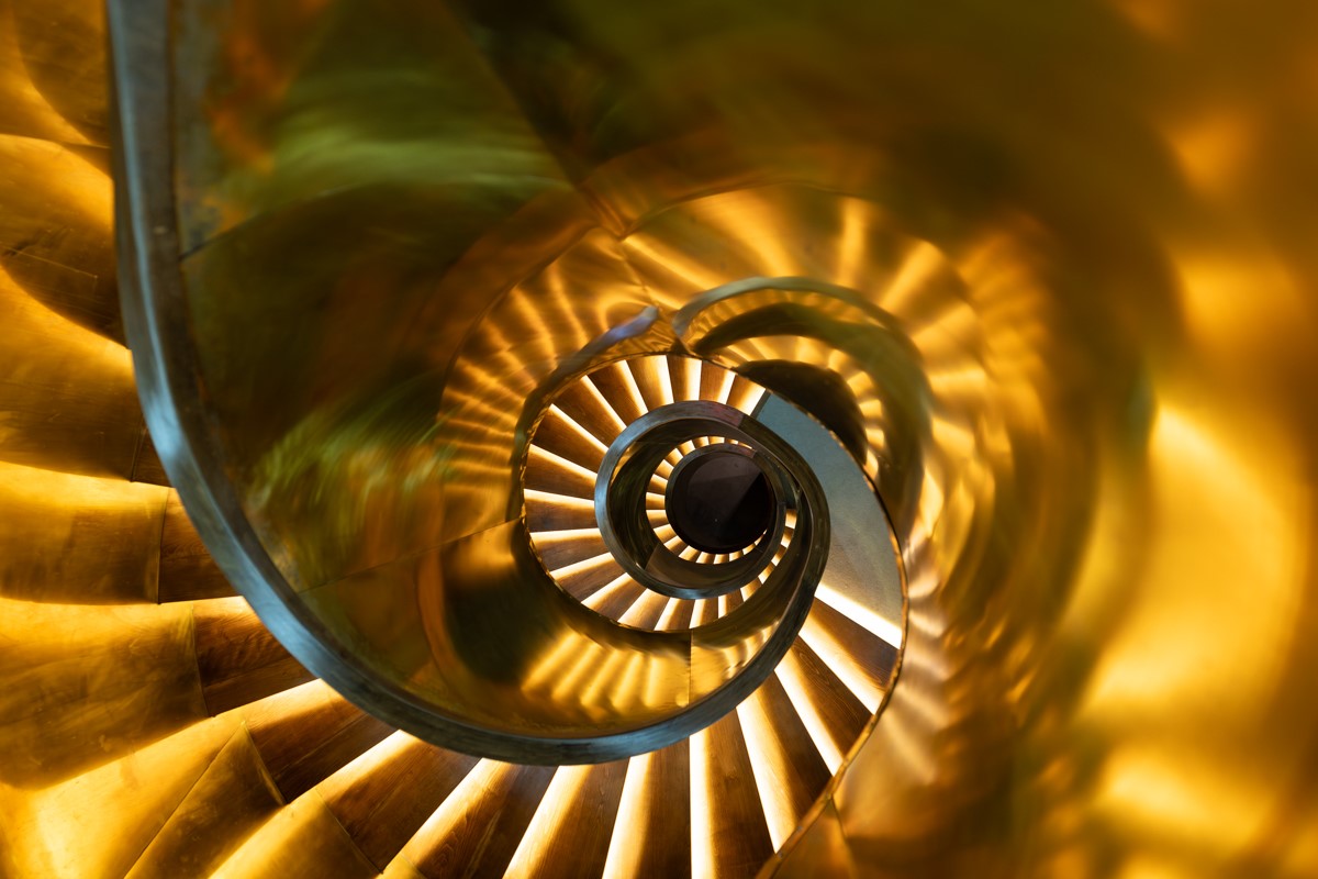 lit spiral staircase photograph