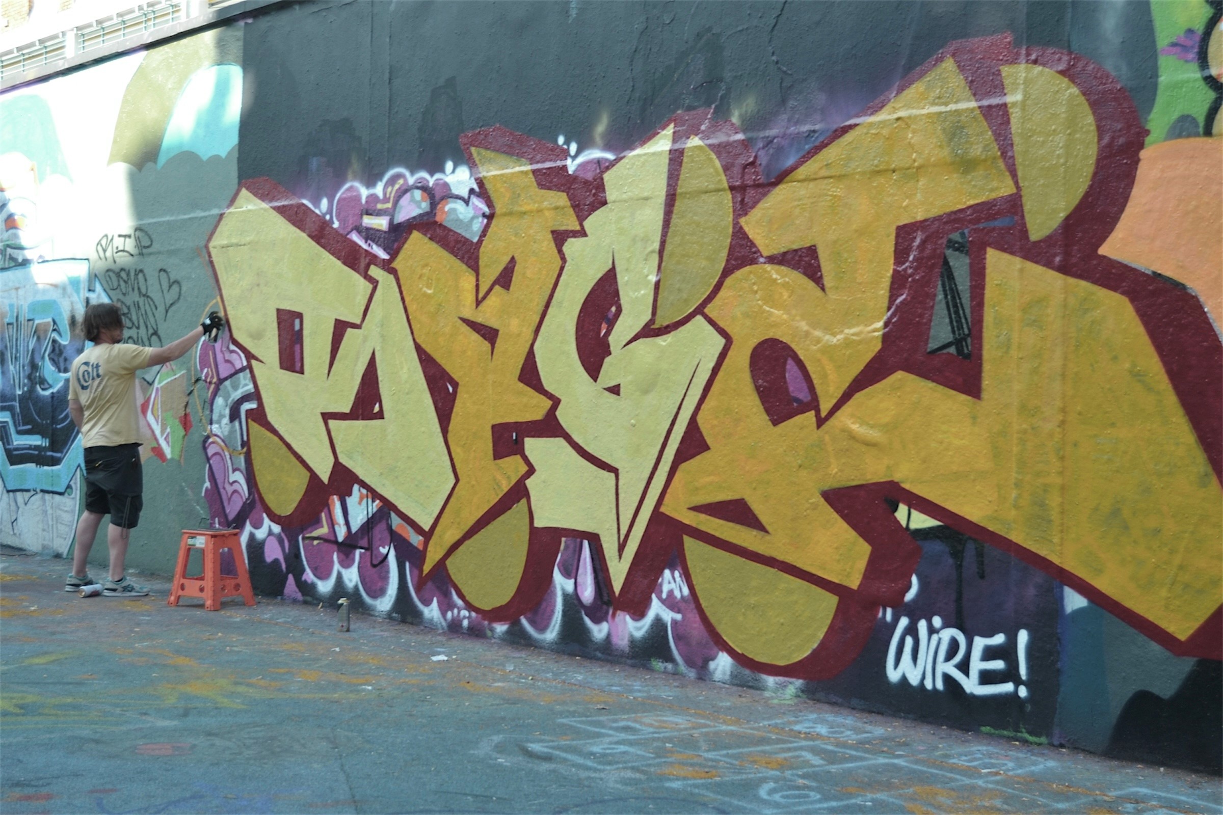 A photo of someone creating street art
