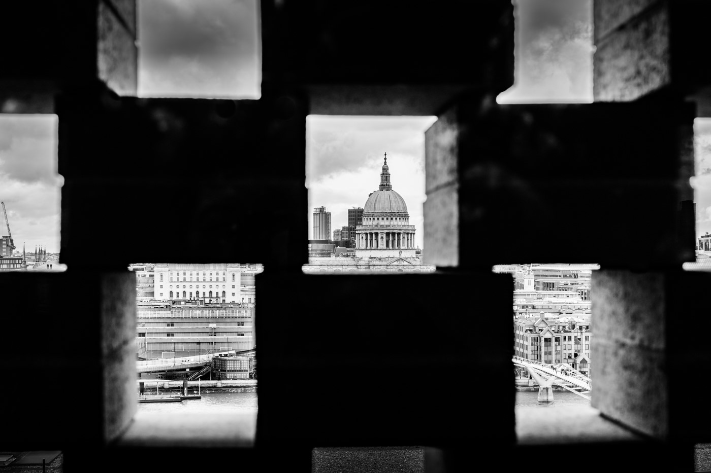 Photograph showing st pauls through a wall with holes