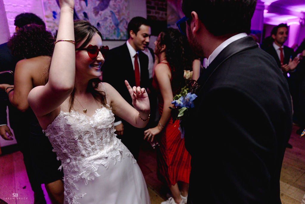 Bride O dancing with sunglasses in the lower gallery 