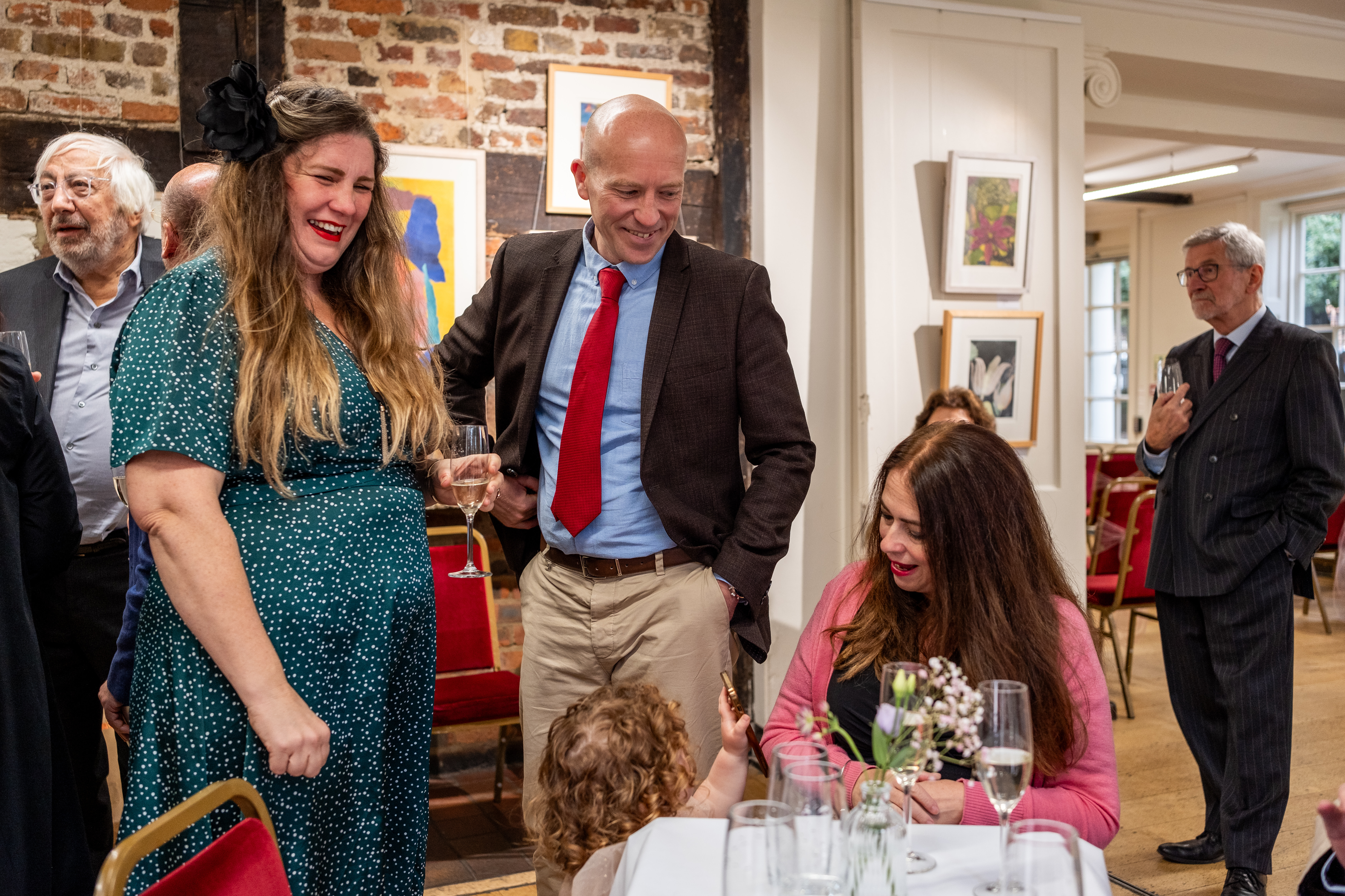 Mingling at a bistro table in the Lower Gallery