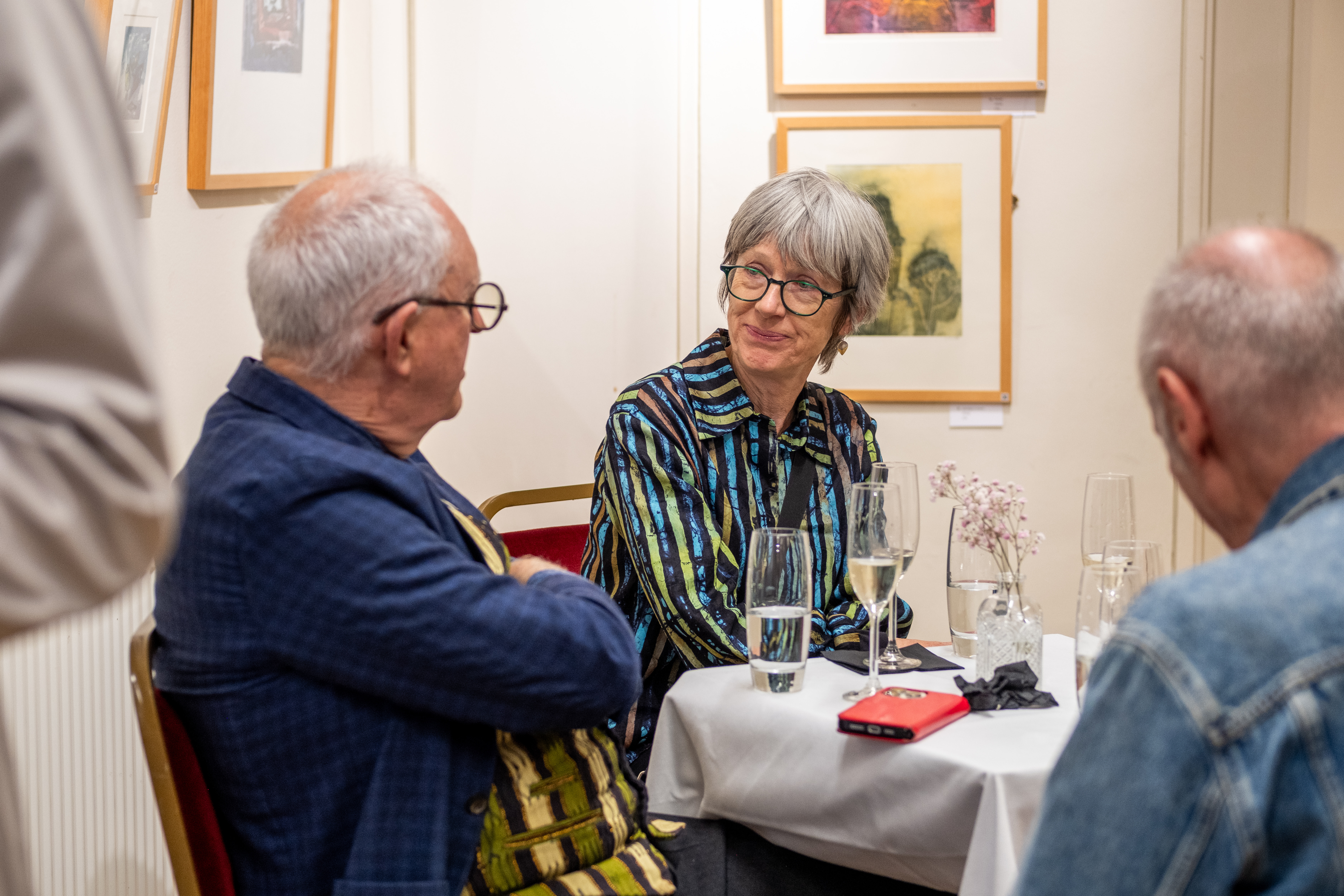 Chatting at the bistro tables in the Lower Gallery