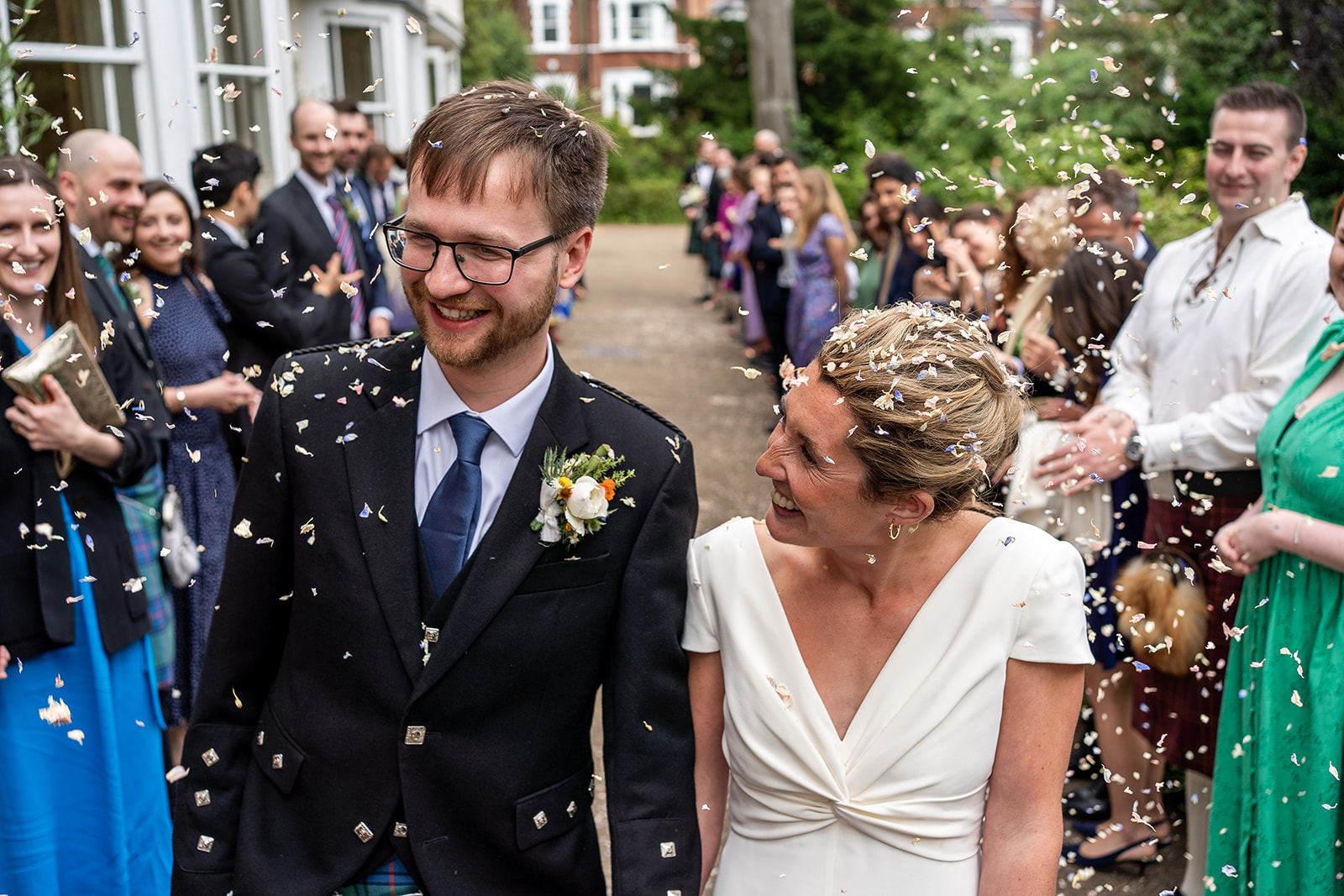 Celebratory petal toss on the side terrace  Credit: Grae Hood Photography 