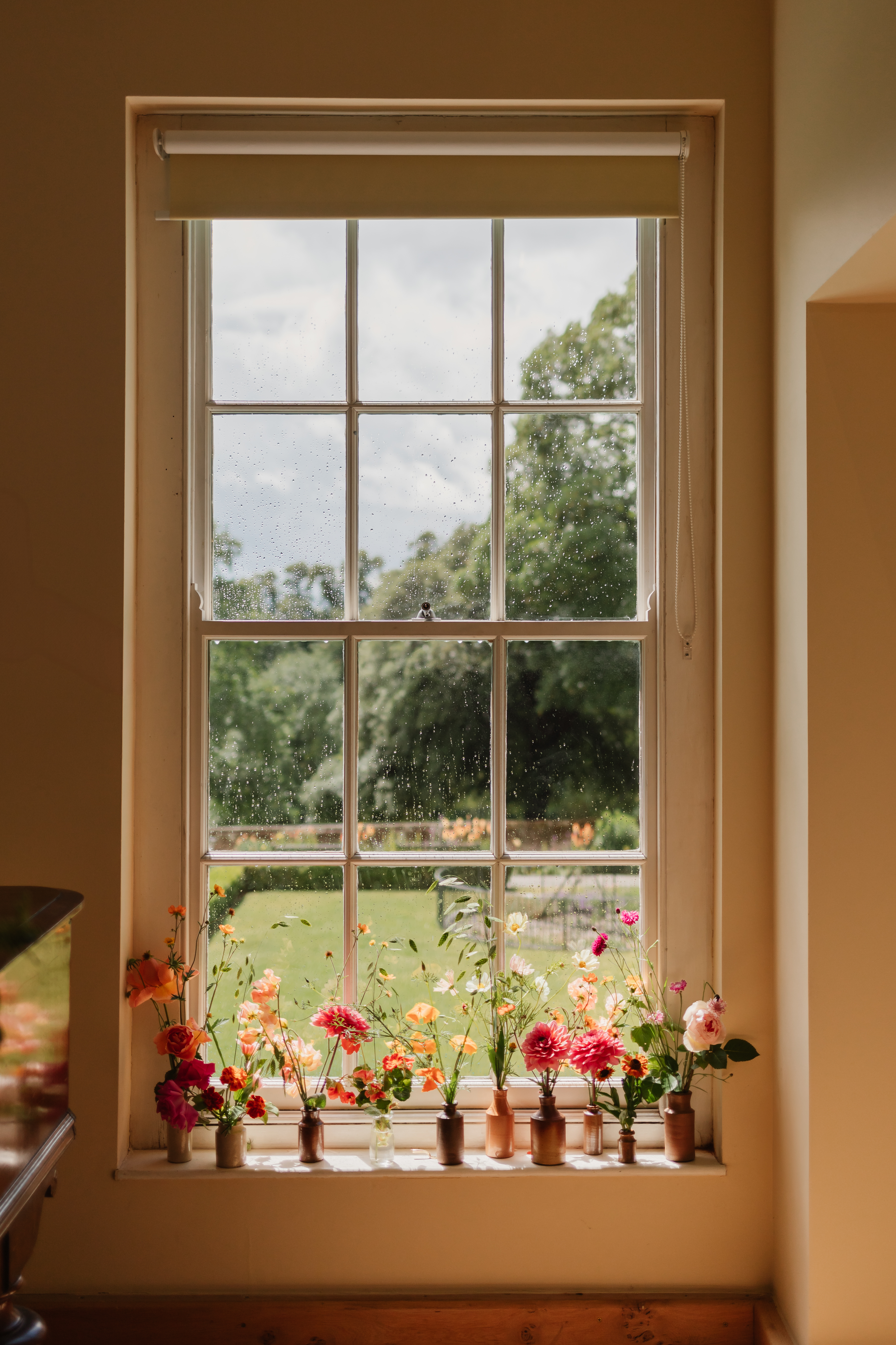 Flowers by the sash window in the Long Gallery  Credit: Claire Wakefield Photography