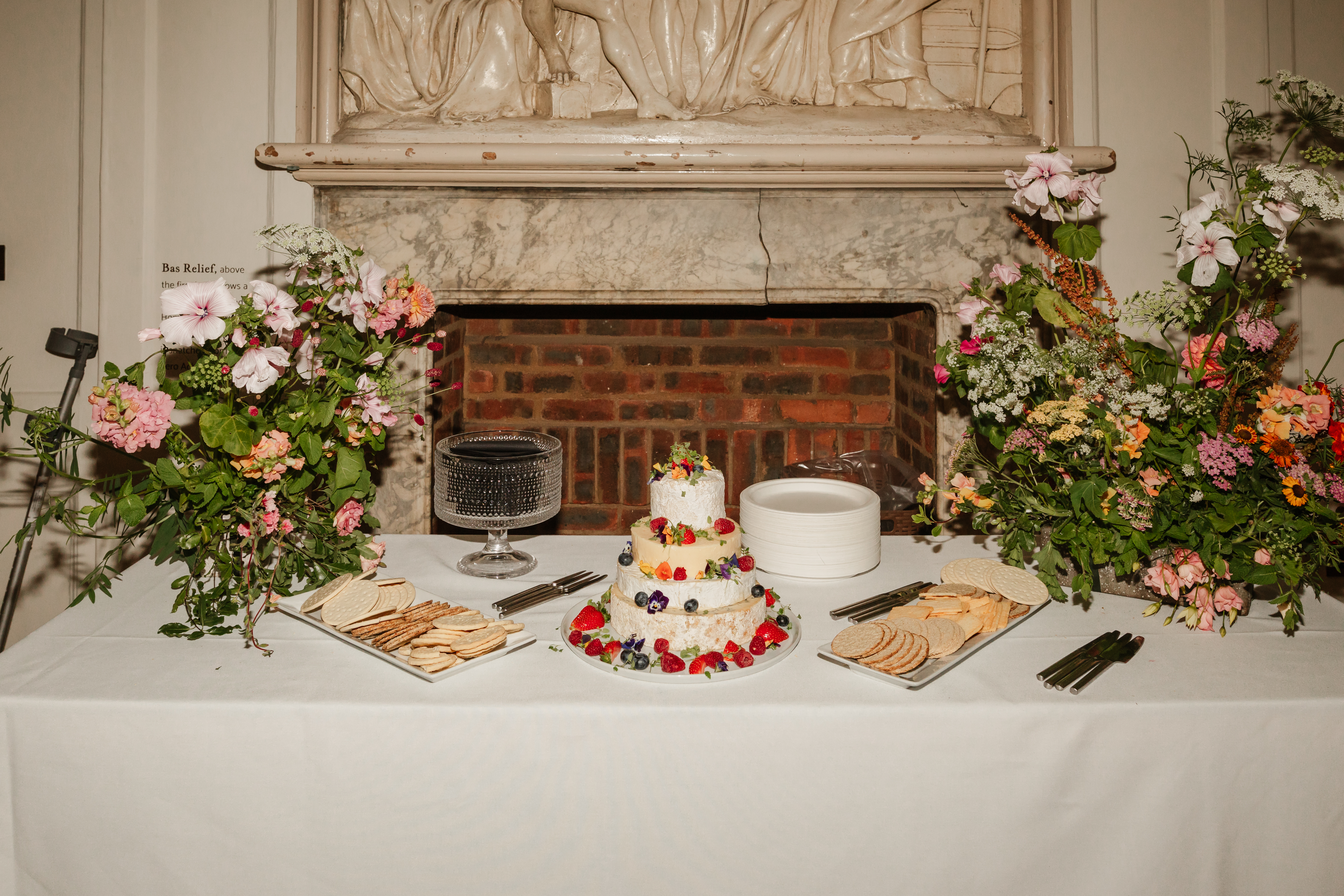 Cheese cake display in front of bas relief Credit: Claire Wakefield Photography