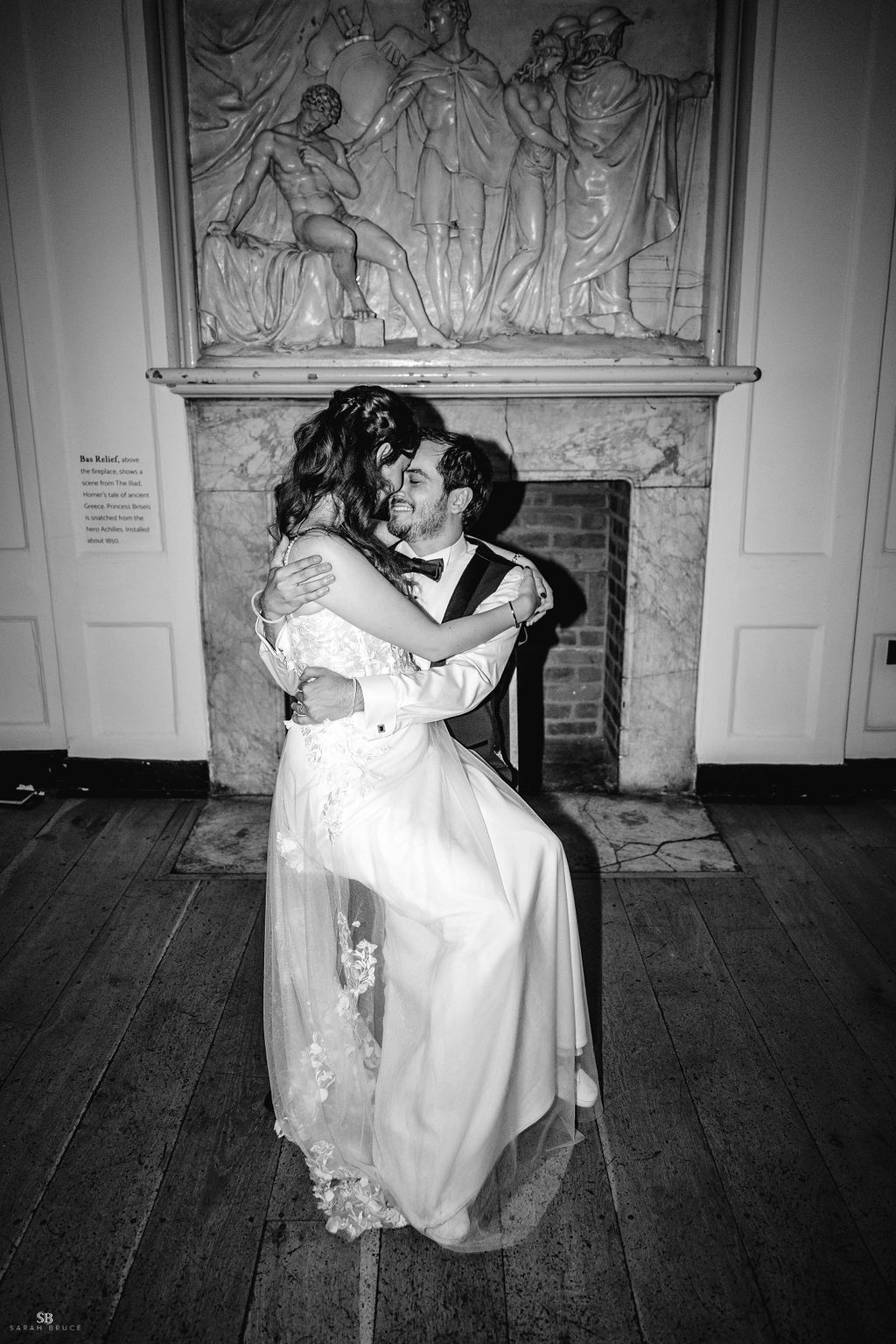 Wedding portrait in front of the bas relief  Credit: Sarah Bruce