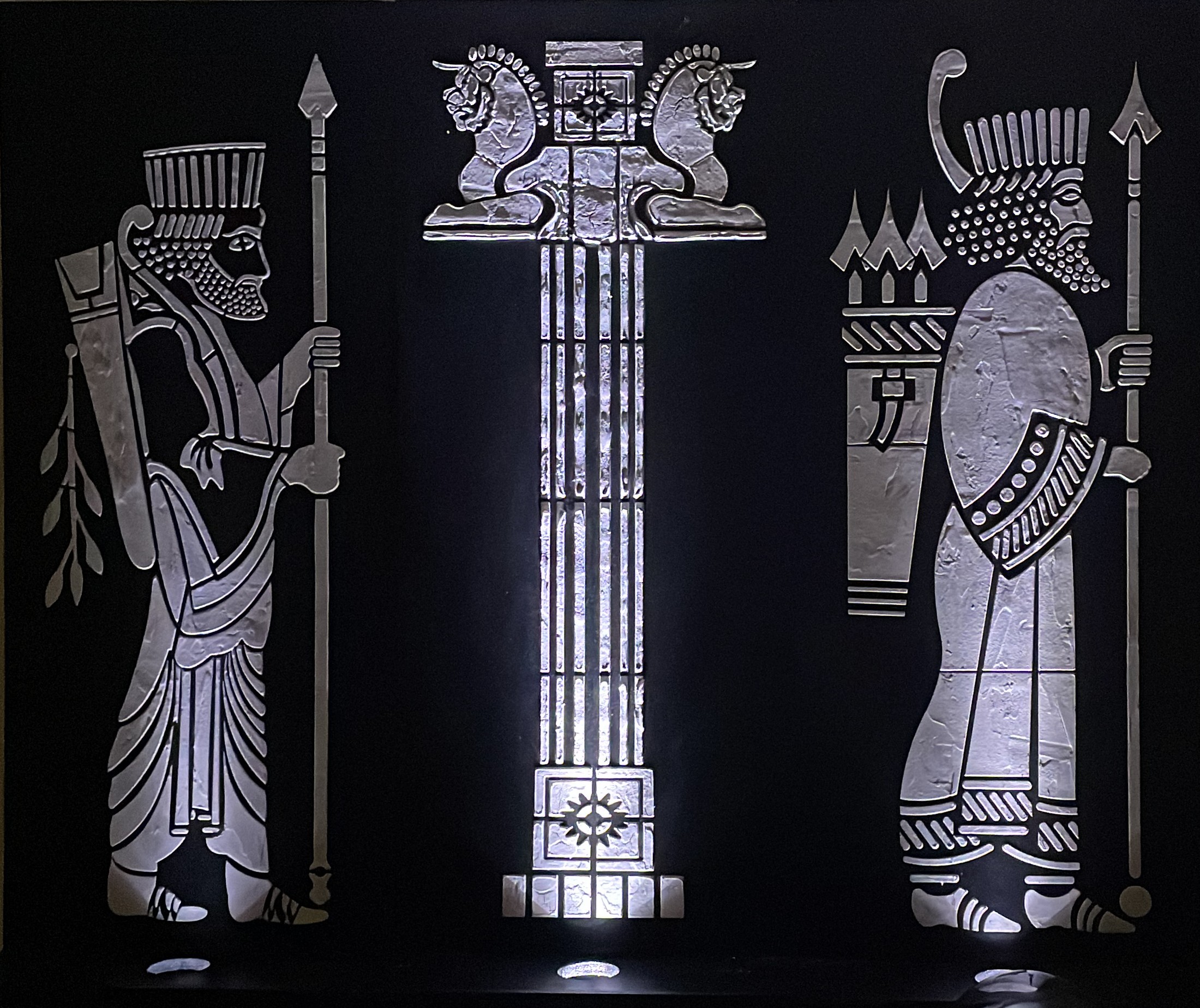 Artwork of two silver silhouettes and column between them on a black background