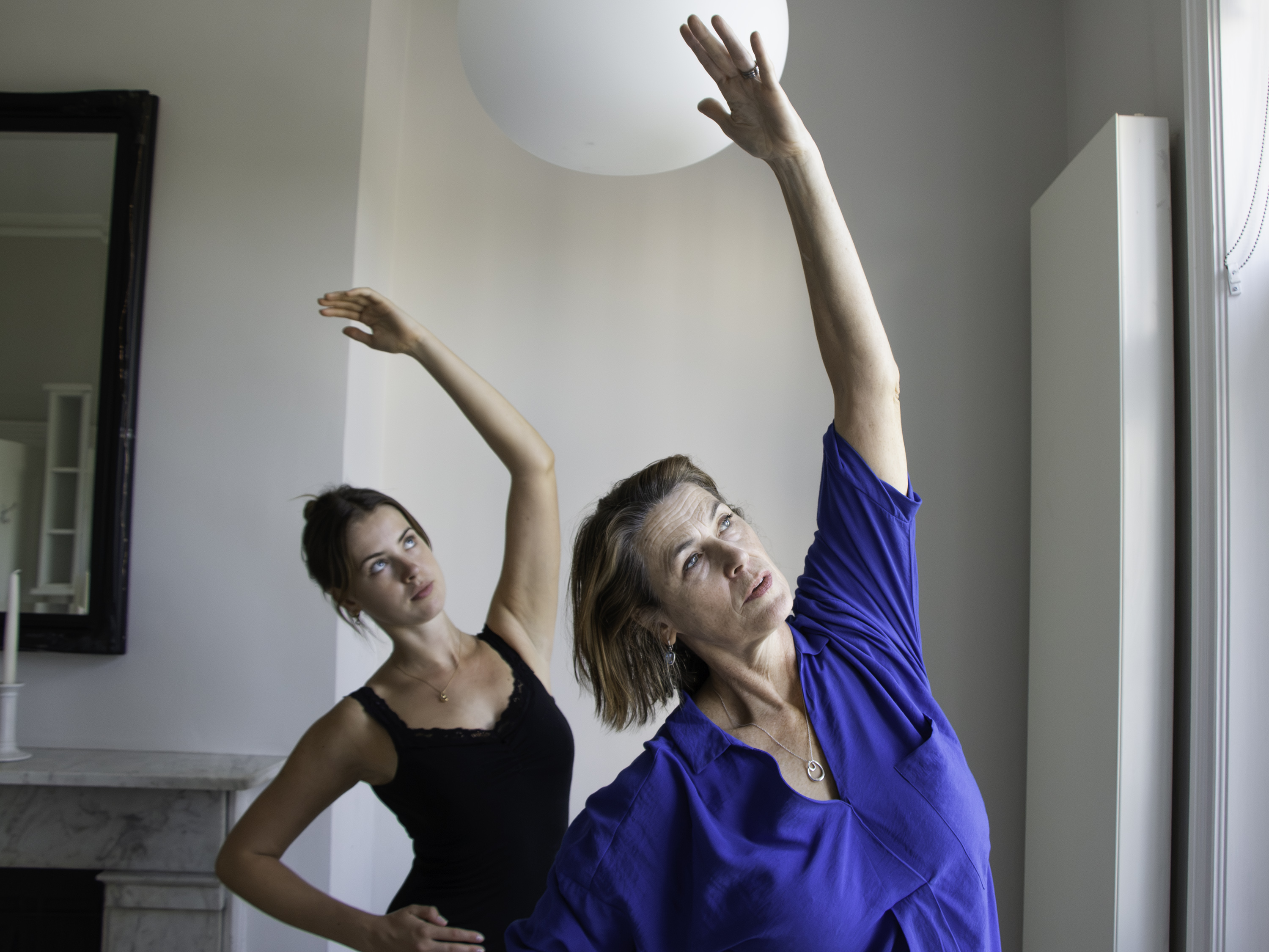 image of teacher and student in a ballet class