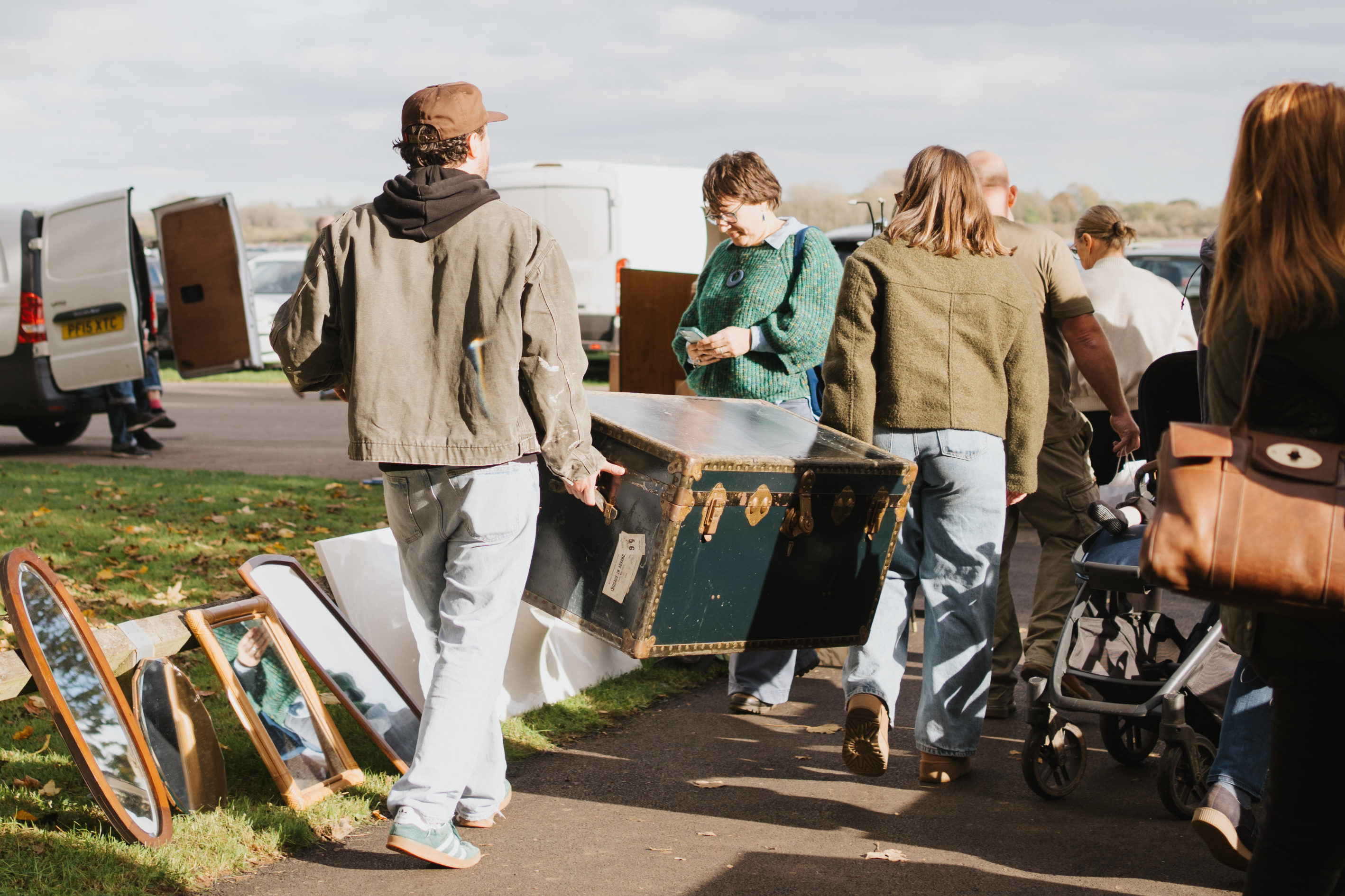 couple carrying vintage trunk