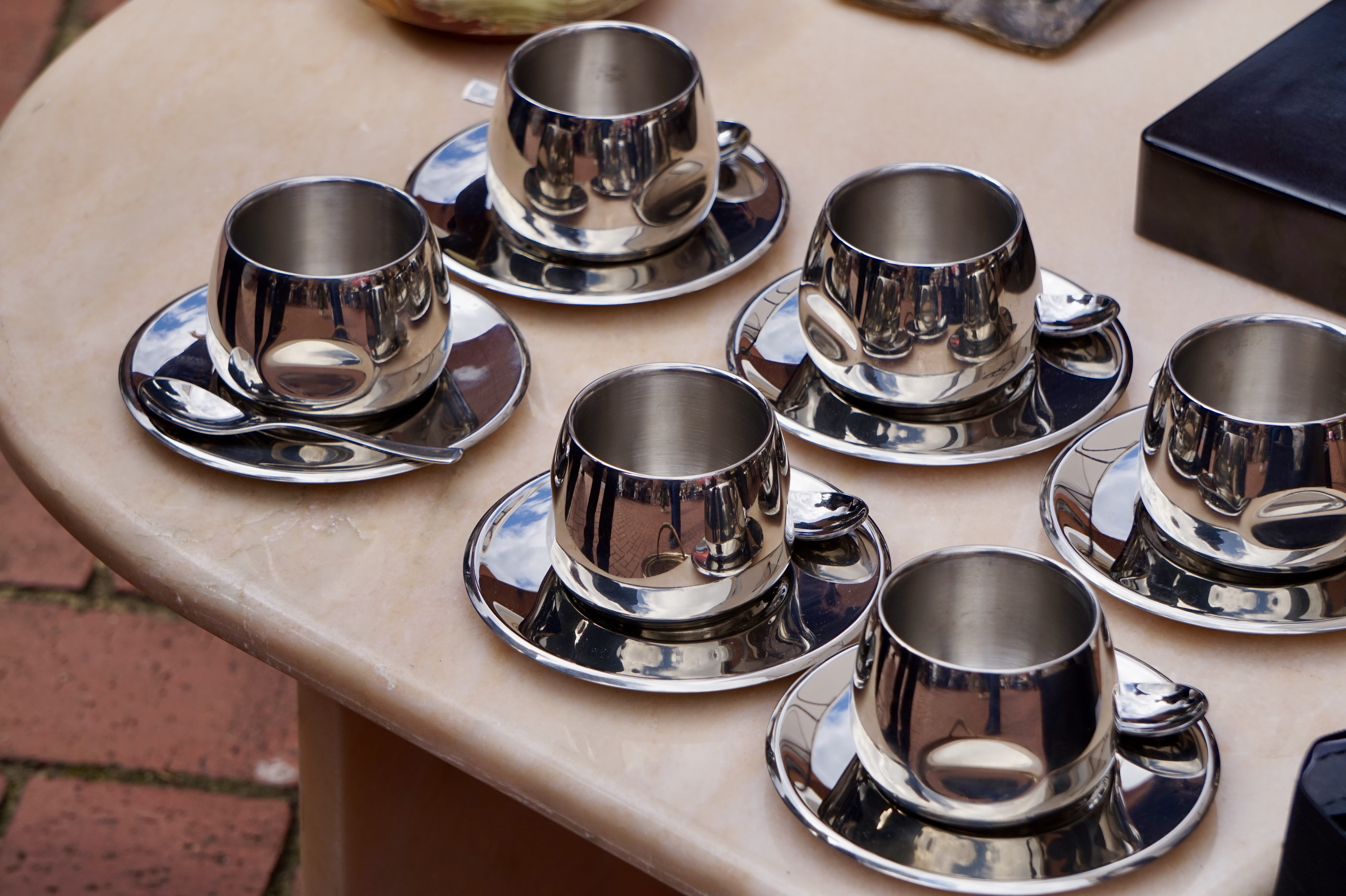 silver mugs on a table