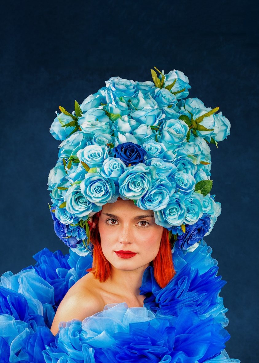 Photo of a woman with blue hat and blue dress