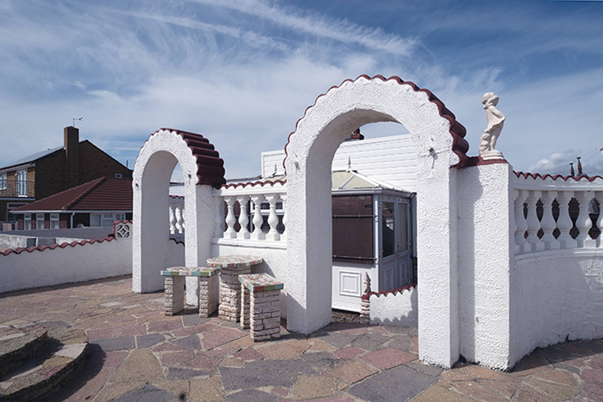 Image of white building with blue sky in background