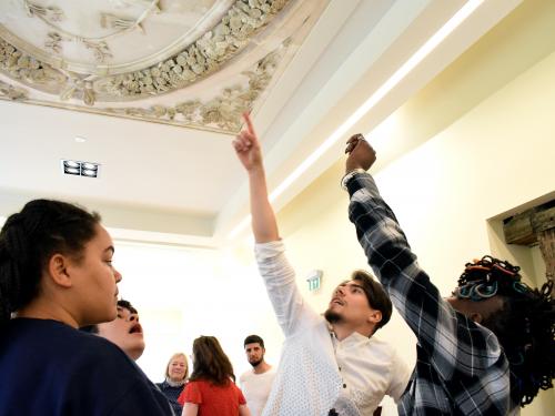 Students pointing at Long Gallery ceiling