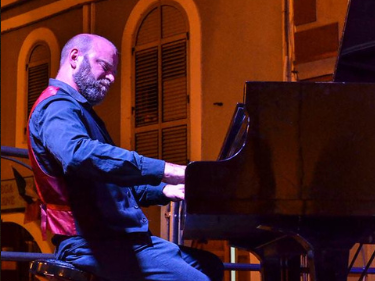 members of the John Crawford Latin Quintet playing together